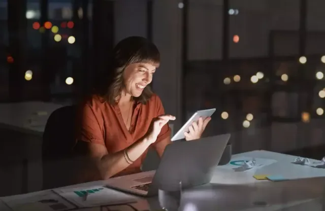 Woman looking at a tablet at an office